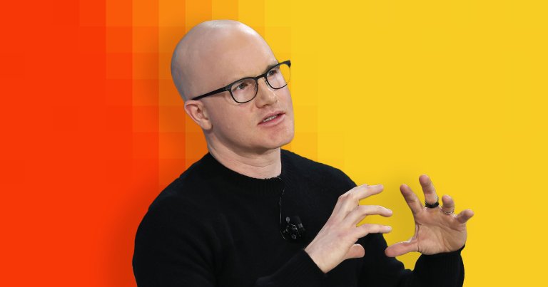 Coinbase CEO Brian Armstrong speaks onstage during the 2025 New York Times Dealbook Summit.