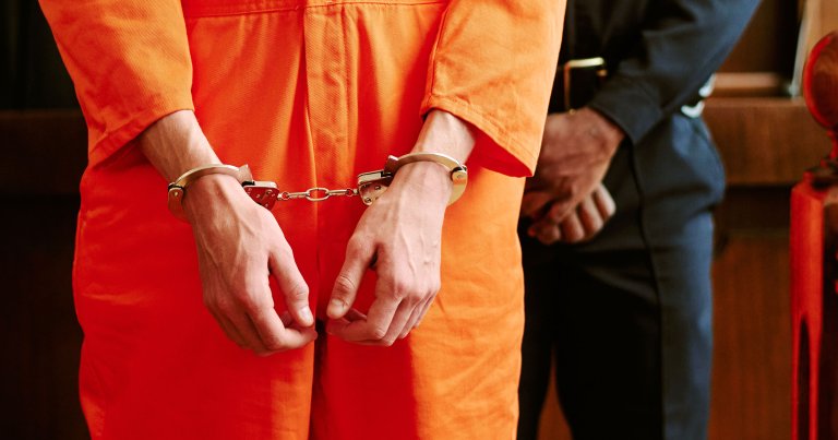 A man in handcuffs while in court.