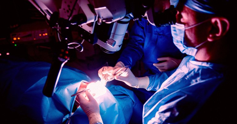 A photo of surgeons operating on a brain.