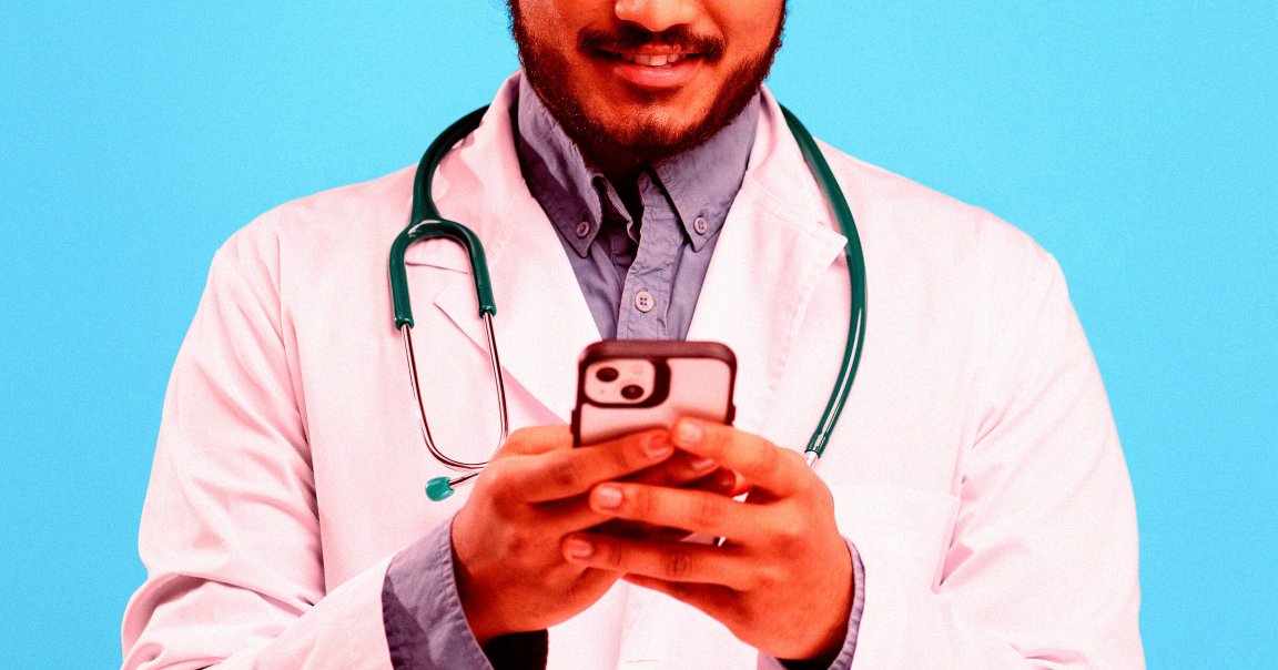 A person wearing a white lab coat and a blue button-up shirt underneath, with a green stethoscope around their neck, is holding and looking at a smartphone. The background is a solid light blue color.