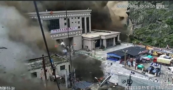 A screenshot of CCTV footage showing a border town between Nepal and China being engulfed in a mudslide.