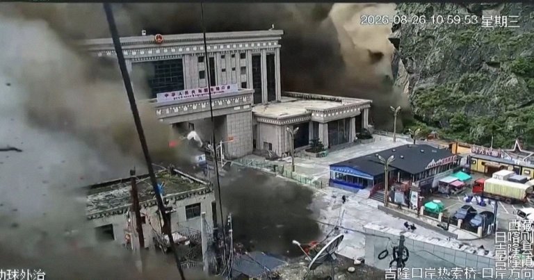 A screenshot of CCTV footage showing a border town between Nepal and China being engulfed in a mudslide.