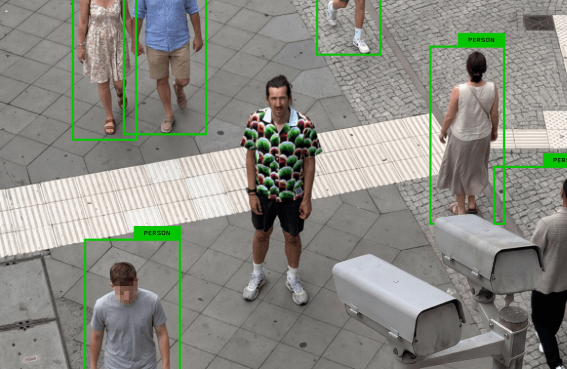A photo shows a man wearing a shirt with a strange pattern while security cameras fail to flag him as human.