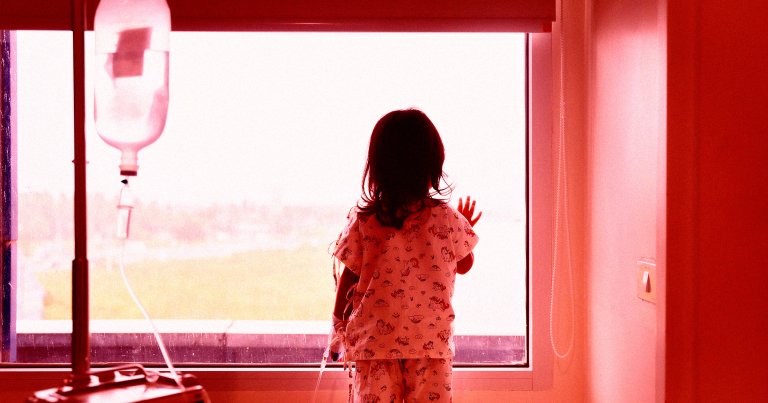 A color-treated photo of a child patient in a hospital.