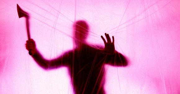 A color-treated photo of a man's silhouette holding an axe behind a plastic sheet.