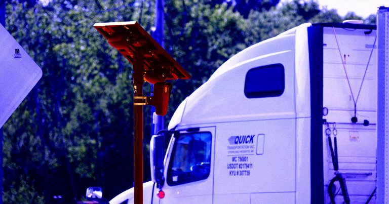 A color-treated photo of a Flock Safety camera.