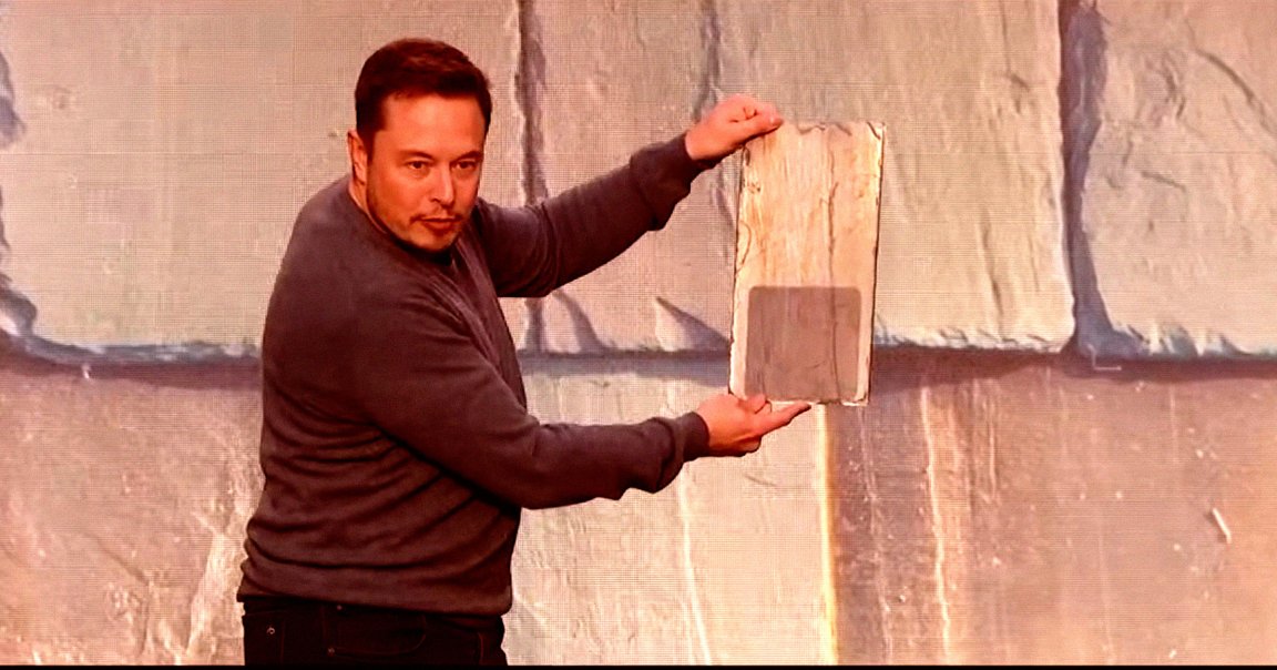 A screenshot of Tesla CEO Elon Musk showing off the company's Solar Roof tiles.