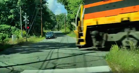 A screenshot of a Tesla trying to drive itself onto train tracks.