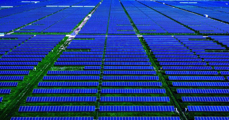 A color-treated photo of a solar farm.