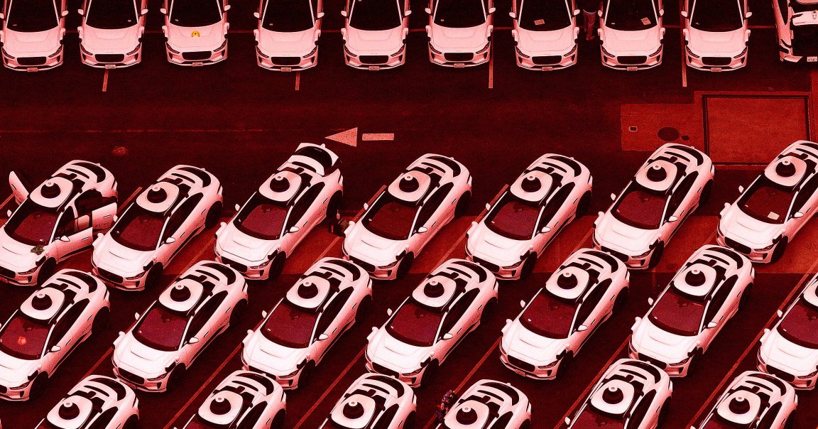 In an aerial view, Waymo cars are seen parked at a Waymo facility.