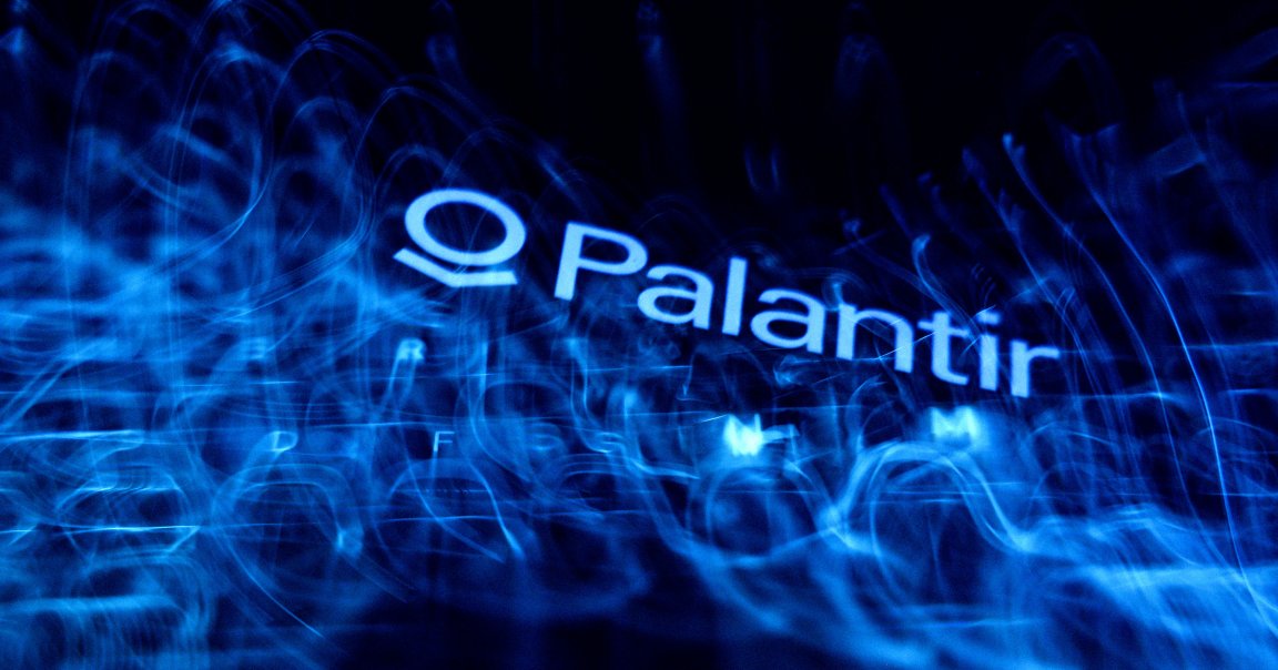A laptop keyboard and Palantir logo displayed on a phone screen.