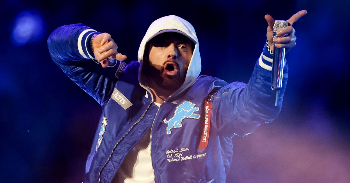 American rapper, songwriter, and record producer Eminem performs with Jack White during an NFL football game.