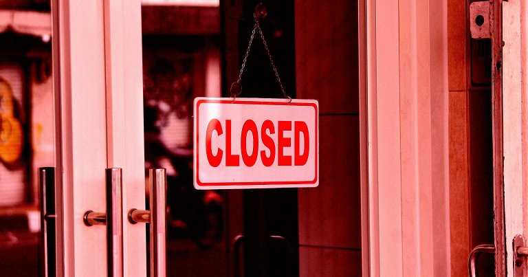 A color-treated photo of a closed sign on the door of a business.