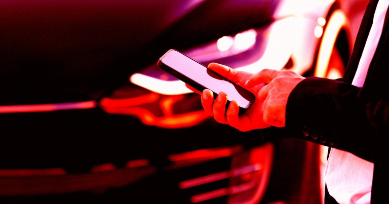 A color-treated photo of a man with a smartphone in front of a Tesla.
