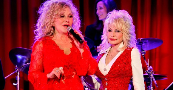Stella Parton and Dolly Parton attend Stella Parton's Red Tent Women's Conference.