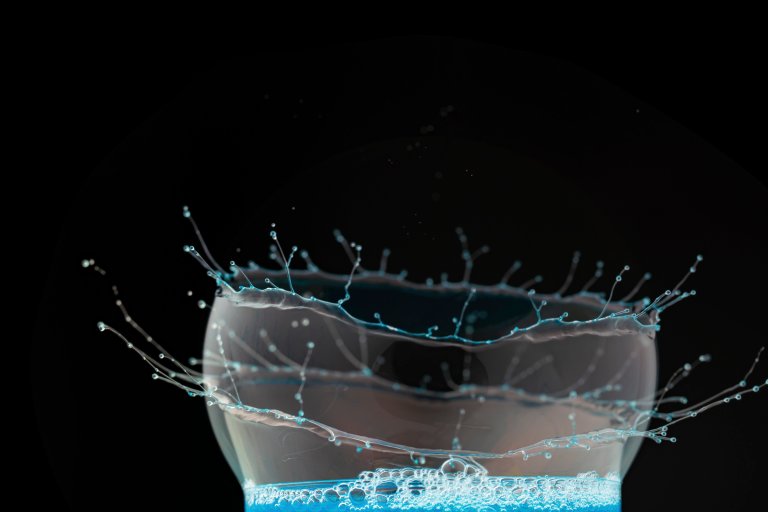 A photo shows a bubble bursting.