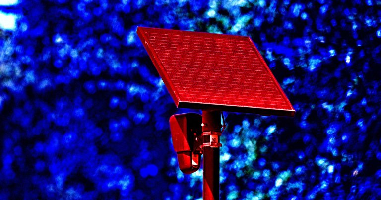 A color-treated photo of a Flock camera.