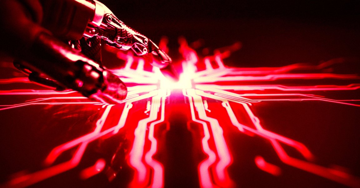 A robotic hand touches an electronic surface.
