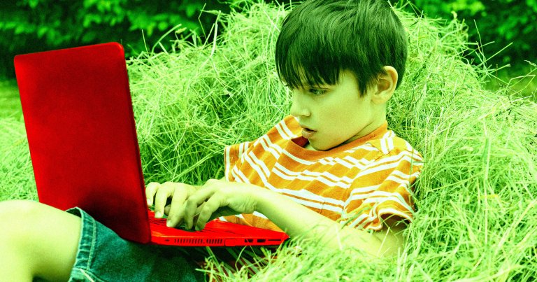 A photo illustration of a boy using a laptop.