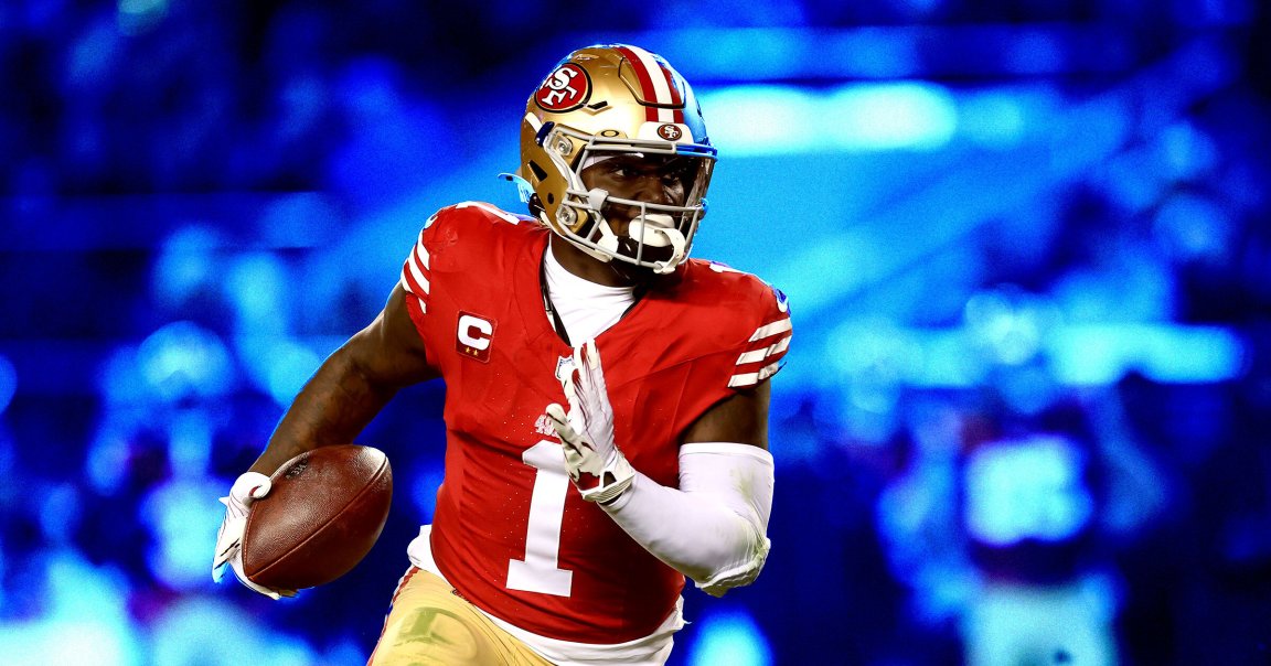 A football player from the San Francisco 49ers wearing a red jersey.