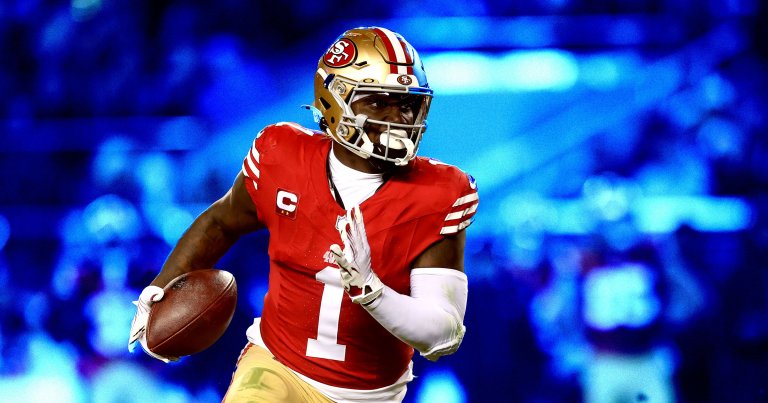 A football player from the San Francisco 49ers wearing a red jersey.
