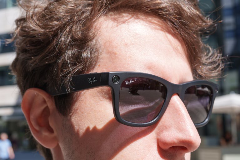 A person is shown wearing a pair of Meta's smart glasses.