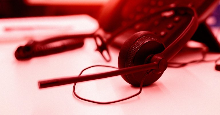 A color-treated photo of a headset on a desk.