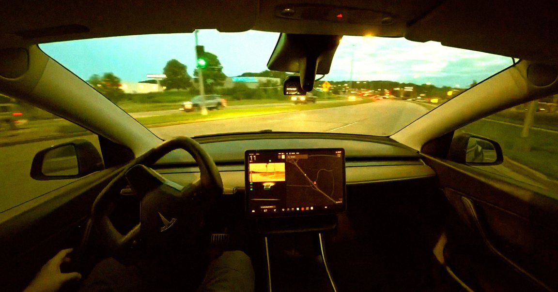 A screenshot of a video showing a Tesla self-driving using an open source AI system.