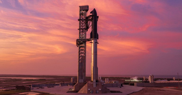 A SpaceX Starship and its booster on the launch pad.