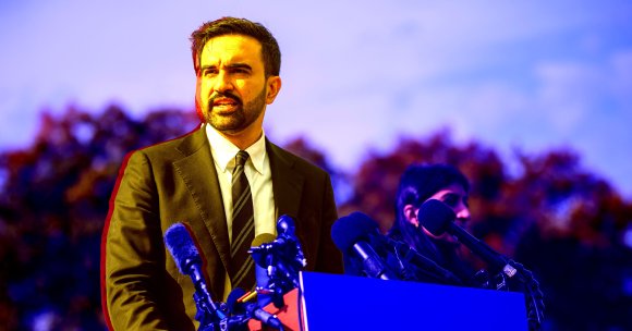 New York City mayor Zohran Mamdani is shown before a podium.