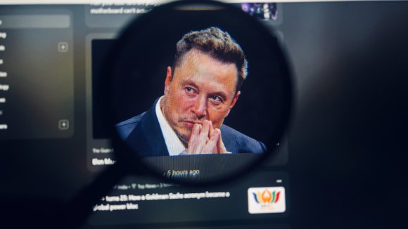 A photo shows Elon Musk on a computer screen.