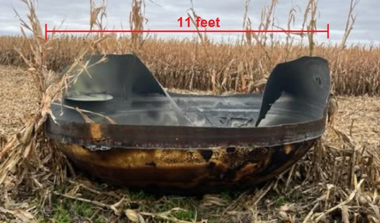 A photo from police shows a large piece of space debris that crashed down in a Minnesota cornfield.