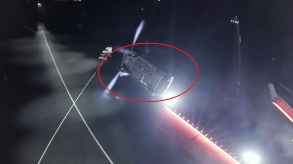 A screenshot of Tesla's "flying Roadster" demo, showing the vehicle's strange-looking underside.