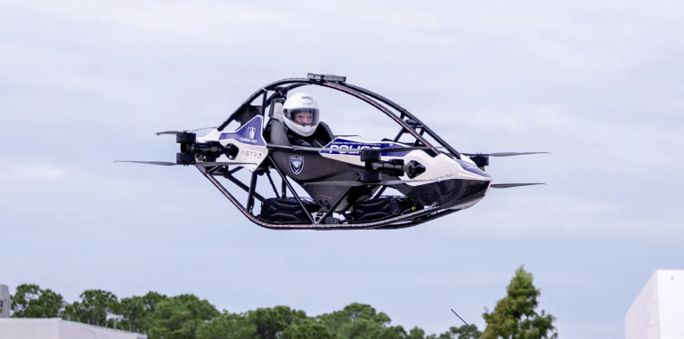 A photo shows a pilot flying Jetson's vehicle.