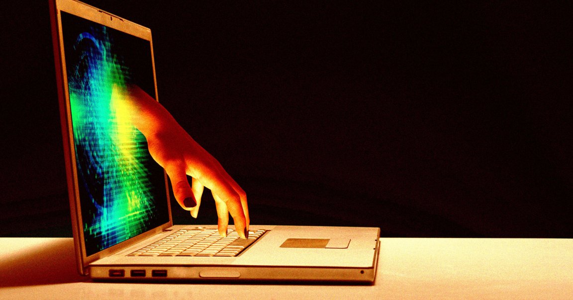 A hand reaching out of a laptop screen.