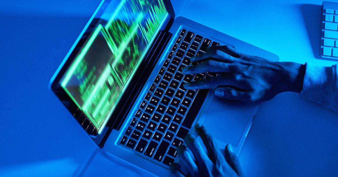 A hacker using a laptop.