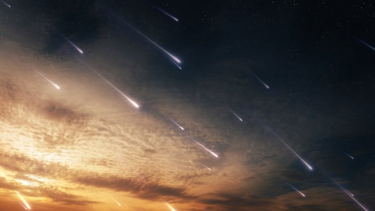 A photo shows the Orionids meteor shower at sunset.