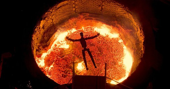 A screenshot of Figure's robots jumping into a vat of liquid metal.
