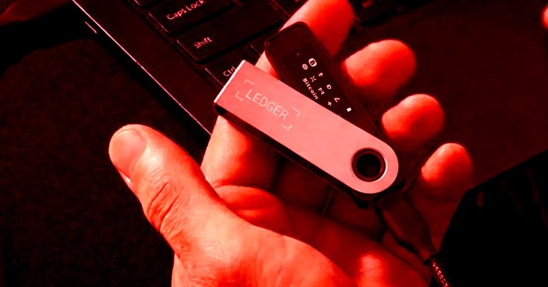 A color-treated photo of a Ledger blockchain wallet key.