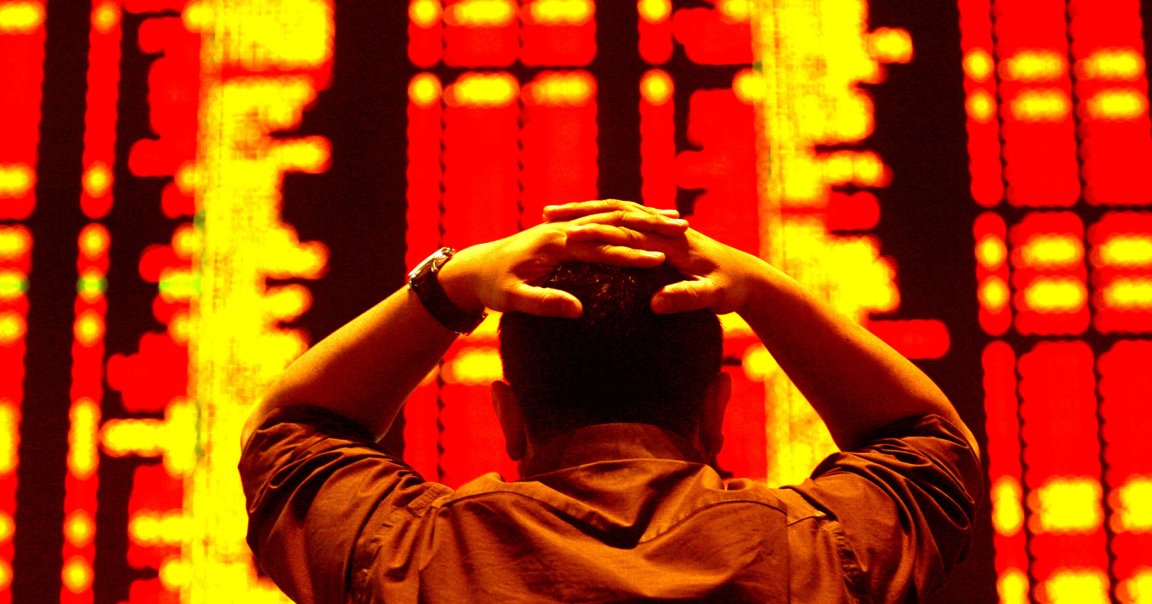 An investor reacts as he monitors the share index at a private stock market gallery.