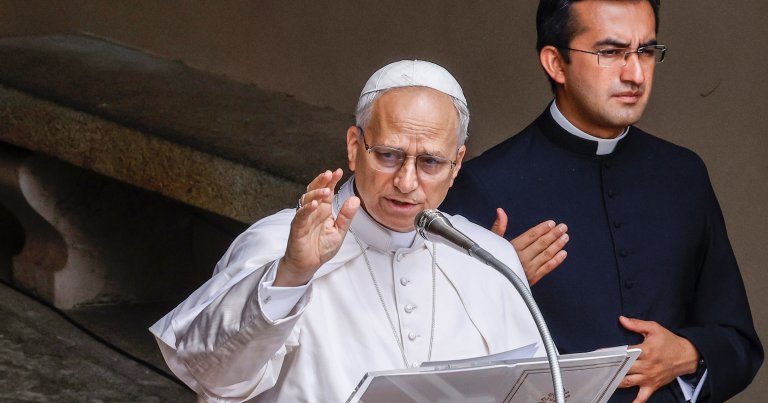 Pope Leo XIV delivers his blessing to the faithful.